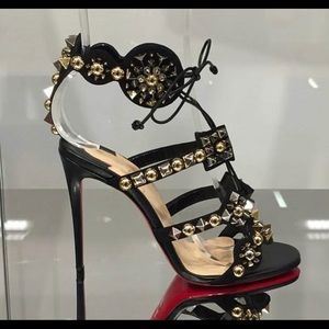Christian Louboutin tie up studded heels.